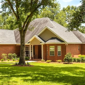 house with grassy lawn